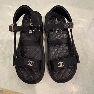 CHANEL Black Quilted Sandals with Gold Logo